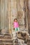 Zoom in child stand at entrance of the tower, Angkor Wat, Siem Reap, Cambodia.