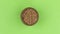 Zoom of a clay pot filled with buckwheat grain. Isolated green screen.