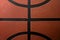 Zoom close up photograph on the bumpy details of a genuine rubber basketball concept for competitive sports backgrounds, athletic