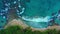Zoom in, down view from drone, azure caribbean sea, wild tropic beach