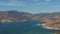 Zoom in fly by of Castaic lake near Los Angeles on a beautiful sunny day, 4k aerial footage.