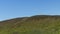 Zoom in hyperlapse tower timelapse of shadows and clouds moving on Radhost Hill overlooking a tower in a dense forest with moving