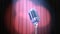 Zoom In Old Fashioned Microphone and Red Curtain with Rotating Spotlights in Volume Light, Beautiful 3d Animation. 4K
