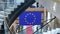 Zoom out from European Union blue flag with yellow stars