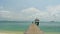 Zoom out pathway to pier on the sea at loneliness beach, full HD.