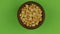 Zoom out, rotation of dry pea grains in a clay pot, isolated