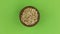 Zoom out, rotation of pearl barley grains in a clay pot, isolated