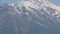 Zoom out shot of grand rocky mountains, glacier on snowy peaks, natural beauty