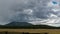 Zoom Out from Storm Clouds to Mountain Meadow