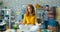 Zoom-out time-lapse portrait of young lady sitting on office desk in lotus pose