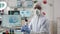 Zoom in portrait of chemist researcher in his modern laboratory