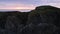 Zoom in shot of birds on mossy green sea stack in Bandon, Oregon Coast