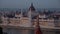 Zoom in to the central dome of The Hungarian Parliament Building from The Fisherman`s Bastion in Budapest, Hungary