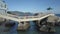 Zoom to Girl on White Stone Bridge across Rocks