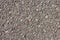 Zoom View Gravel on Asphalt Road Texture Background