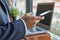 Zoom View Hand of Businessman Using Smartphone in Coffee Shop Scene