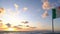 Zoom in view Italian flag waving on windy sea coast over sunset horizon, italy