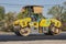 Zoom View Worker and Road Roller on Asphalt Road