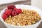 Zoomed shapy cereals with berries with spoon