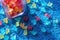 zoomed shot of colorful gummy bears scattered on a blue rug