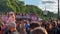 Zoomed shot of happy people dancing on truck with thematic graphics at Christopher Street Day. LGBT festival, Berlin