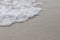 Zooming of beach. Sand and water wave for background