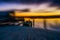 Zooming the focus ring on the camera at Okarito Lagoon at sunrise