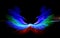 Zooming photo effect in the night with colorful bursts blue red green that looks like abstract angel wings