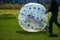 Zorb For Kids. Children roll inside the ball on the field