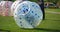 Zorb For Kids. Children roll inside the ball on the field