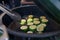 Zucchini being fried on grill