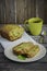 Zucchini bread with raisins and orange juice on a wooden background