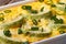 Zucchini casserole with cheese in a dish. horizontal macro