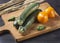 Zucchini. Fresh vegetables on a wooden board. Vegan food