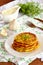 Zucchini fritters with garlic and dill on a plate. Close-up