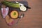 Zucchini and pumpkin soup on a brown wooden background, sliced zucchini on a wooden cutting Board.