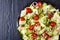 Zucchini ribbon salad on a black plate