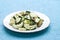 Zucchini salad with egg and olives