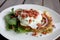Zucchini and Sweet Potato Fritter with fried egg bacon and salad