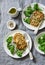 Zucchini turkey burgers and poached broccoli on a gray background, top view. Healthy balanced food concept.