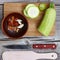 Zucchini - zucchini. Concept: vegetarian food, healthy food. Seth healthy foods. Zucchini, spices, olive oil on a wooden backgroun