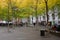 Zuccotti Park, with lighted trees, is a half-acre plaza in Lower Manhattan now synonymous with Occupy