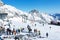 Zugspitze, Germany - December 29, 2018 : Many people in ski area at Zugspitze mountain. People in colored ski suits. Snowblowers