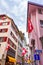 Zurich city historic center narrow street with national flags Switzerland