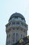 Zurich/ Switzerland - 05 02 2020: Urania astronomy observatory tower, its upper part with dome with blue sky on the background.