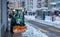 Zurich, Switzerland - January 15th 2021: A snowplow on a footway in operation