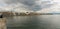 Zurich, ZH / Switzerland - April 8, 2019: tourist admires the cityscape and lakeshore view of Zurich during the hustle and bustle