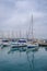 Zygi, Cyprus - June 16, 2018: yachts, motor boats and cruisers moored in Zygi`s harbor. Taken on a summer afternoon with an