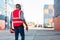 à¹‡Hand Foreman holding walkie- talkie for control working at Container cargo site. Handheld walkie talkie for outdoor