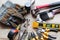 à¹‡Hardware tools, equipment used for repair and maintenance work in general technicians isolated on wooden background closeup.